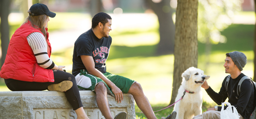 students sitting on quad talking